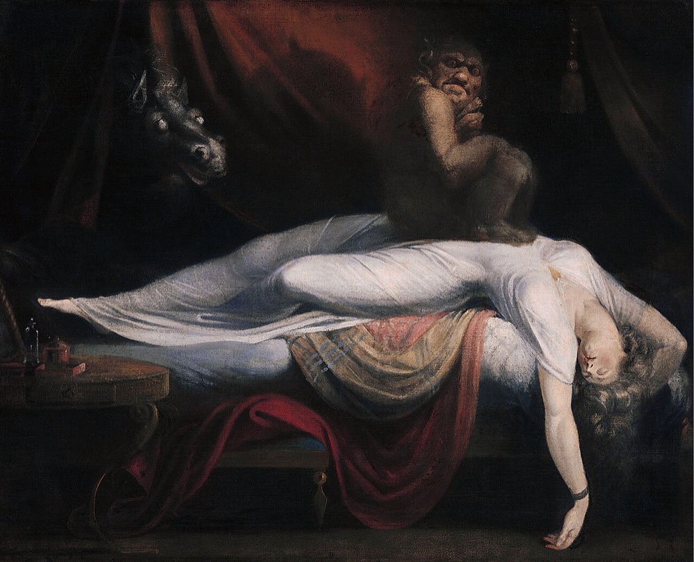 A woman sprawls asleep on her back with a small demonic incubus crouched on her chest, as a pale, wild-eyed horse's head emerges through dark curtains behind her.